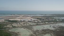5K aerial stock footage of flying by Naval Air Station Key West; Key West, Florida Aerial Stock Footage | AX0026_056