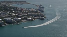 5K aerial stock footage fly by hotels on the shore, approach Royal Caribbean ship, Key West, Florida Aerial Stock Footage | AX0026_068