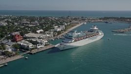 5K aerial stock footage of orbiting a Royal Caribbean Cruise Ship docked in Key West, Florida Aerial Stock Footage | AX0026_069E