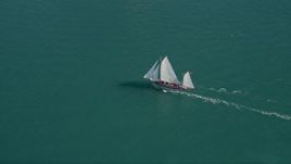 5K aerial stock footage of a sailboat off the shore of Key West, Florida Aerial Stock Footage | AX0026_074