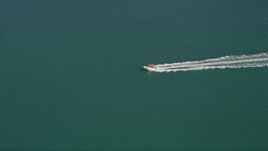 5K aerial stock footage of tracking a speedboat off the shore of Key West, Florida Aerial Stock Footage | AX0026_084
