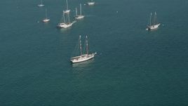 5K aerial  video of flying by sailboat moored off the shore of Key West, Florida Aerial Stock Footage | AX0026_085