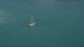 5K aerial stock footage of tracking a sailboat on the open water by Key West, Florida Aerial Stock Footage | AX0026_094