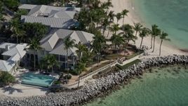 5K aerial stock footage of orbiting homes on the shore of Sunset Key by Key West, Florida Aerial Stock Footage | AX0026_103