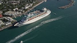 5K aerial stock footage of flying by Royal Caribbean Cruise Ship docked, Key West, Florida Aerial Stock Footage | AX0027_015