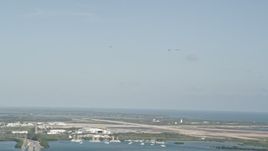 5K aerial stock footage of tracking four F-18s in flight above Naval Air Station Key West, Key West, Florida Aerial Stock Footage | AX0027_033