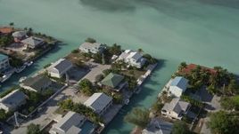 5K aerial stock footage of flying by homes on canals, Big Coppitt Key, Florida Aerial Stock Footage | AX0027_043