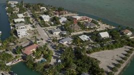 5K aerial stock footage of flying over residential neighborhood, tilt down, Lower Sugarloaf Key, Florida Aerial Stock Footage | AX0027_049