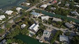 5K aerial stock footage of flying over homes near the shore of Lower Sugarloaf Key, Florida Aerial Stock Footage | AX0027_051