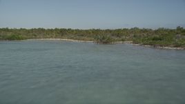 5K aerial stock footage of following the shore of Upper Sugarloaf Key, Florida, fly over mangroves Aerial Stock Footage | AX0027_054E
