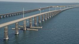 5K aerial stock footage of ascending next to a rise in Seven Mile Bridge, Florida Aerial Stock Footage | AX0027_081