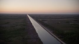 5K aerial stock footage of Aerojet Canal, Southern Glades, Florida, twilight Aerial Stock Footage | AX0028_053