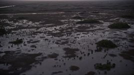 5K aerial stock footage of flying by wetlands, Southern Glades, Florida, twilight Aerial Stock Footage | AX0028_054