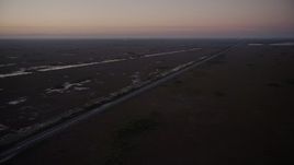 5K aerial stock footage of flying by South Dixie Highway, Southern Glades, Florida, twilight Aerial Stock Footage | AX0028_057