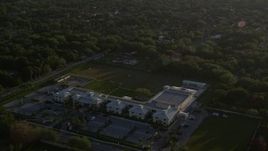 5K aerial stock footage of approaching Riviera Preparatory School in Kendall, Florida, sunrise Aerial Stock Footage | AX0029_003
