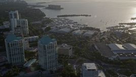 5K aerial stock footage fly over office buildings, approach yacht clubs, Coconut Grove, Florida, sunrise Aerial Stock Footage | AX0029_006