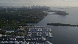 5K aerial stock footage fly over marinas, Downtown Miami skyline, Coconut Grove, Florida, sunrise Aerial Stock Footage | AX0029_007