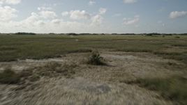 5K aerial stock footage of flying over marshland, Florida Everglades, Florida Aerial Stock Footage | AX0030_048