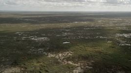 5K aerial stock footage of flying over marshland, wide angle view, Florida Everglades, Florida Aerial Stock Footage | AX0030_116