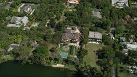 5K aerial stock footage of approaching mansion, tilt down, Coral Gables, Florida Aerial Stock Footage | AX0031_005