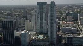 5K aerial stock footage of approaching North and South Tower of Vizcayne, tilt to pool, Downtown Miami, Florida Aerial Stock Footage | AX0031_027E