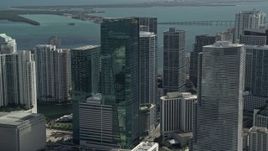 5K aerial stock footage of flying by Wells Fargo Center, downtown buildings and skyscrapers, Downtown Miami, Florida Aerial Stock Footage | AX0031_029