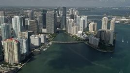 5K aerial stock footage of flying by downtown buildings and skyscrapers and Brickell Key, Downtown Miami, Florida Aerial Stock Footage | AX0031_034E