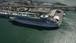 5K aerial stock footage of orbiting a cruise ship docked, Port of Miami, Florida  Aerial Stock Footage | AX0031_040