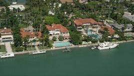 5K aerial stock footage of mansions on the shore, Palm Island, Florida Aerial Stock Footage | AX0031_044
