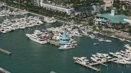 5K aerial stock footage fly by yachts, fishing boats, Miami Beach Marina, South Beach, Florida Aerial Stock Footage | AX0031_048
