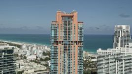 5K aerial stock footage of flying by Portofino Tower, South Beach, Miami Beach, Florida Aerial Stock Footage | AX0031_049