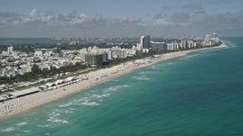 5K aerial stock footage of flying by the beach, South Beach, Miami Beach, Florida Aerial Stock Footage | AX0031_052