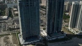 5K aerial stock footage reveal Jade Ocean, Jade Beach Condominium Complexes, Sunny Isles Beach, Florida Aerial Stock Footage | AX0031_081