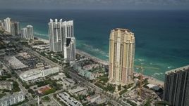 5K aerial stock footage of Acqualina Resort and Spa, Trump International Beach Resort, Sunny Isles Beach, Florida Aerial Stock Footage | AX0031_083