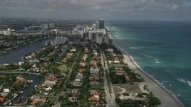 5K aerial stock footage fly over neighborhood, approach Hallandale Beach, Golden Beach, Florida Aerial Stock Footage | AX0031_088