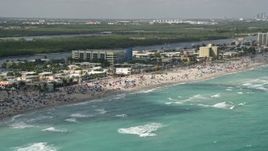 5K aerial stock footage of flying by people at the beach, Hollywood, Florida Aerial Stock Footage | AX0031_094