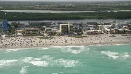 5K aerial stock footage of a crowded beach in Hollywood, Florida Aerial Stock Footage | AX0031_095