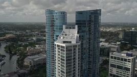 5K aerial stock footage of flying by the top of Las Olas River House, Downtown Fort Lauderdale, Florida Aerial Stock Footage | AX0031_116
