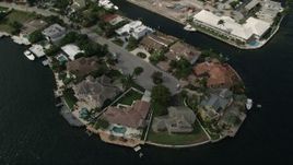 5K aerial stock footage of approaching mansions by canals, tilt down, Fort Lauderdale, Florida Aerial Stock Footage | AX0031_139