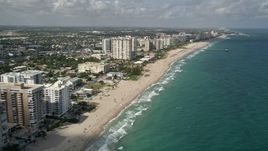 5K aerial stock footage of following the beach along the coast, Pompano Beach, Florida Aerial Stock Footage | AX0031_151E