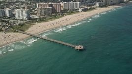 5K aerial stock footage of approaching Pompano Beach Pier, then orbiting pier, Pompano Beach, Florida Aerial Stock Footage | AX0031_153