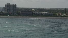 5K aerial stock footage of flying by kite surfers, Pompano Beach, Florida Aerial Stock Footage | AX0031_167E