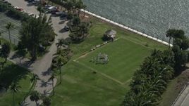 5K aerial stock footage of orbiting croquet players at Hillsboro Club, Hillsboro Beach, Florida Aerial Stock Footage | AX0031_175