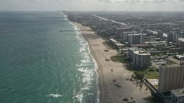 5K aerial stock footage of following beach, approaching Pompano Beach Pier, Pompano Beach, Florida Aerial Stock Footage | AX0031_179