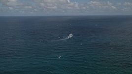 5K aerial stock footage of following speedboat cruising on the Atlantic, Pompano Beach, Florida Aerial Stock Footage | AX0031_180