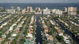 5K aerial stock footage of flying over residential neighborhoods on canals, Pompano Beach, Florida Aerial Stock Footage | AX0032_003