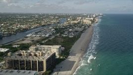 5K aerial stock footage of flying over the beach, revealing more of Hillsboro Beach, Florida Aerial Stock Footage | AX0032_013E