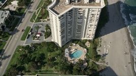 5K aerial stock footage of flying over pool area, coastal condominium complex, Boca Raton, Florida Aerial Stock Footage | AX0032_023