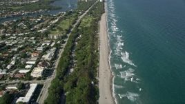 5K aerial stock footage of flying by the beach, South Beach Park, revealing coastline, Boca Raton, Florida Aerial Stock Footage | AX0032_025