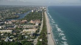 5K aerial stock footage of following the coast, orbit condo complex on North Ocean Boulevard, Boca Raton, Florida Aerial Stock Footage | AX0032_028E